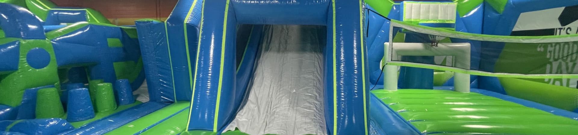 Inflatable slide inside Play and Spin indoor bounce park in Niles Illinois