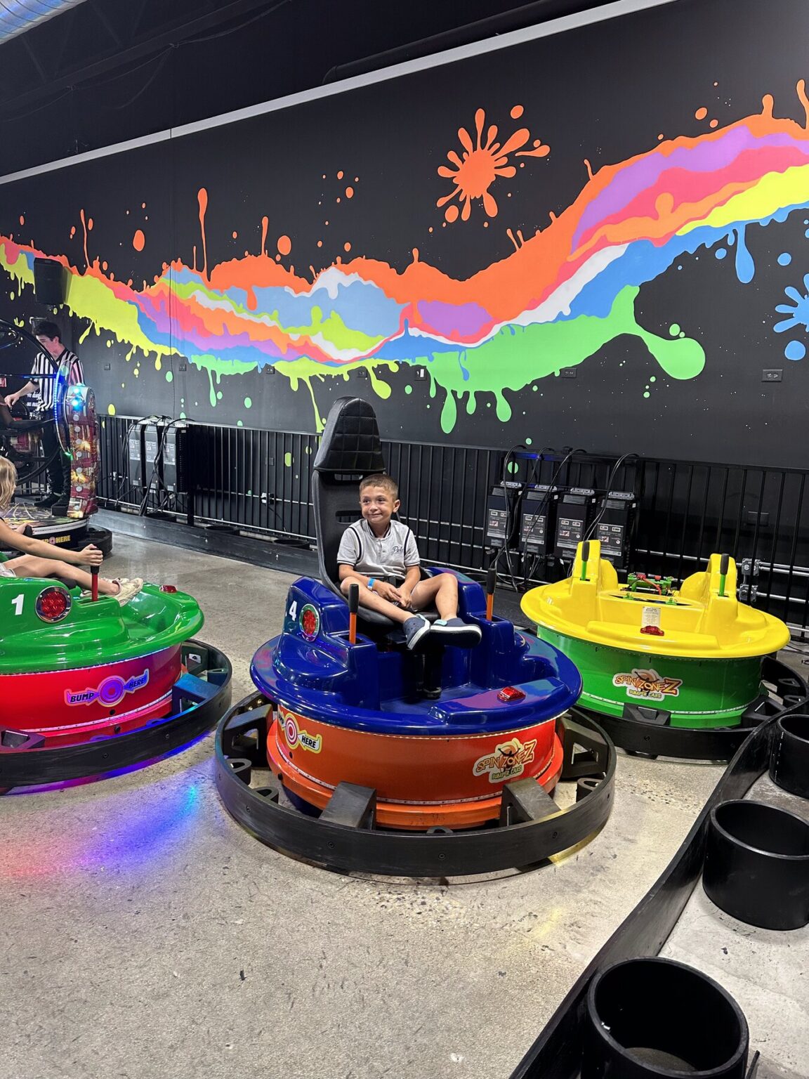 Play and Spin floor attendant supervising the bumper car arena in Niles IL